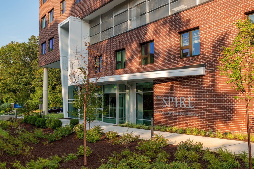 a large brick building with the word spire on it