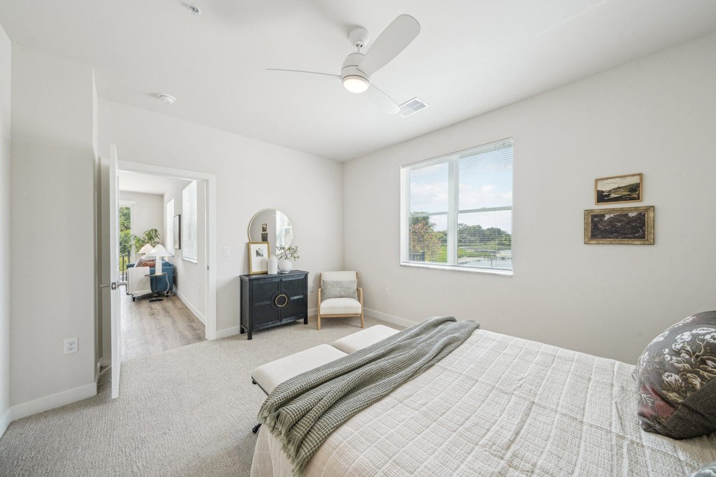 a bedroom with a large bed and a window