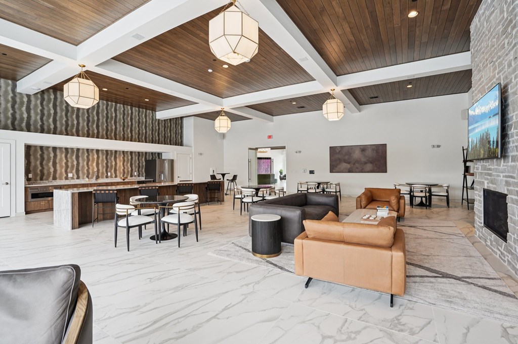 A modern living room with a fireplace and a television.
