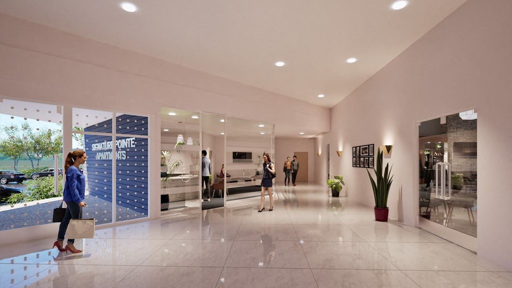 people walking in a lobby of a building