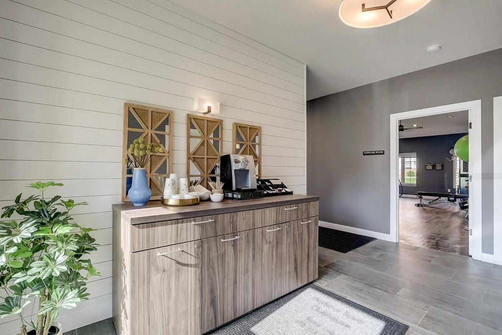 a kitchen with a counter and a door into a room