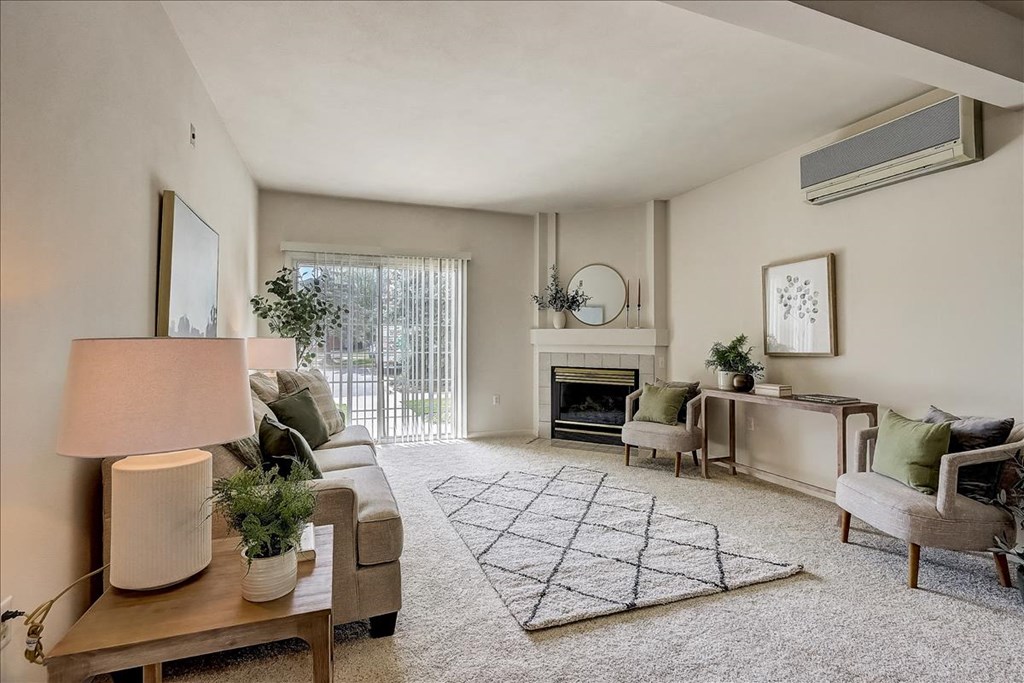 a living room with a couch and a fireplace