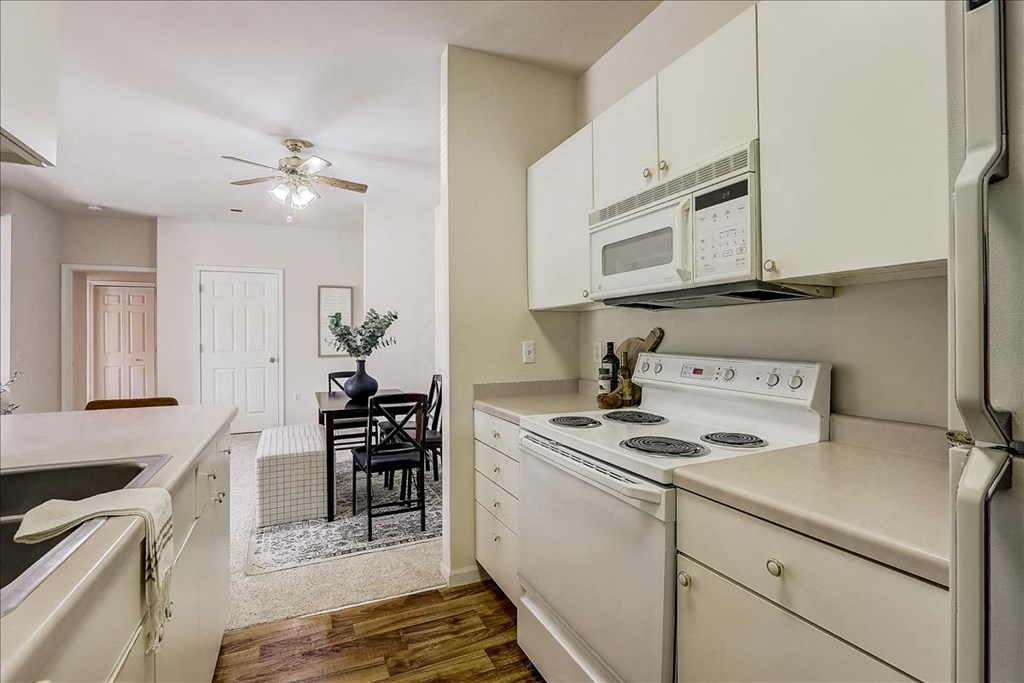 a kitchen with a stove and a microwave