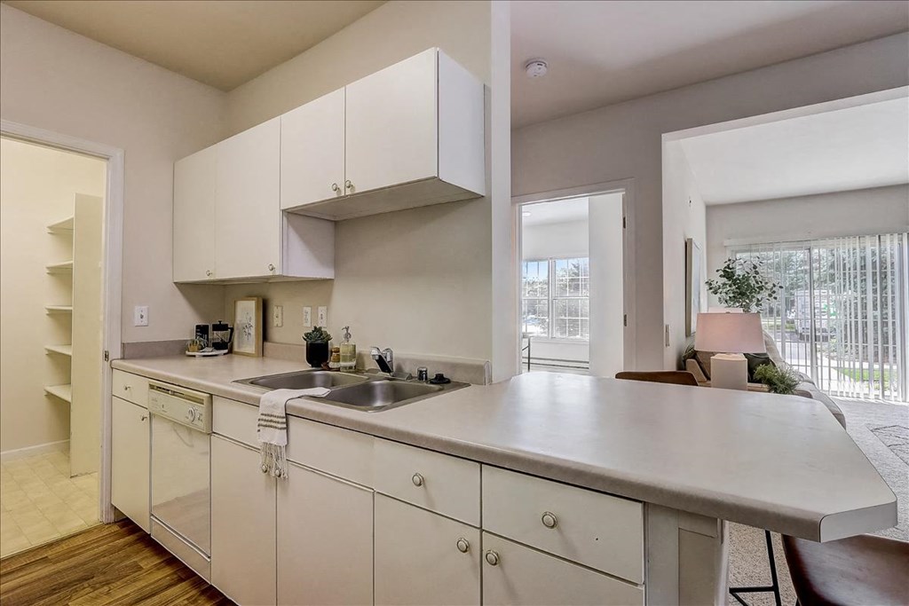 a kitchen with a sink and a large counter top