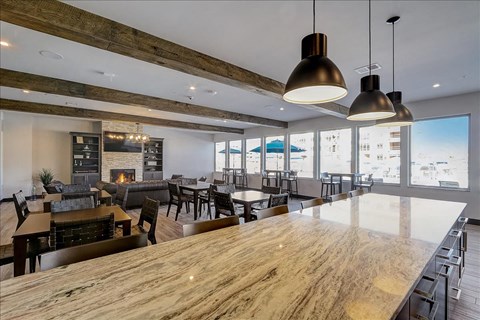 a large bar and dining room with a view of the ocean