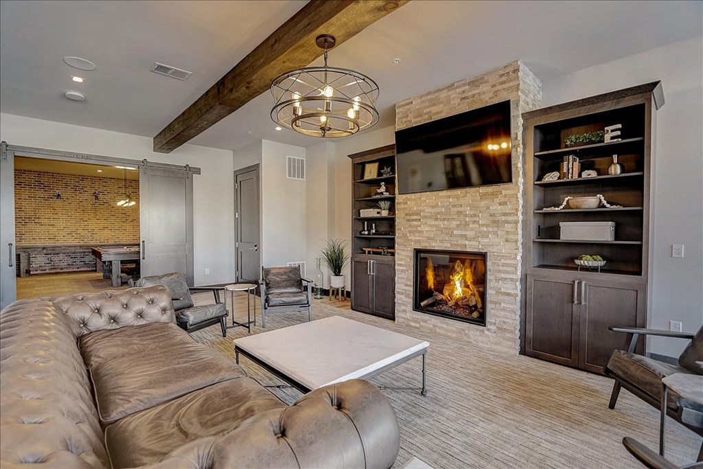a living room with a couch and a fireplace