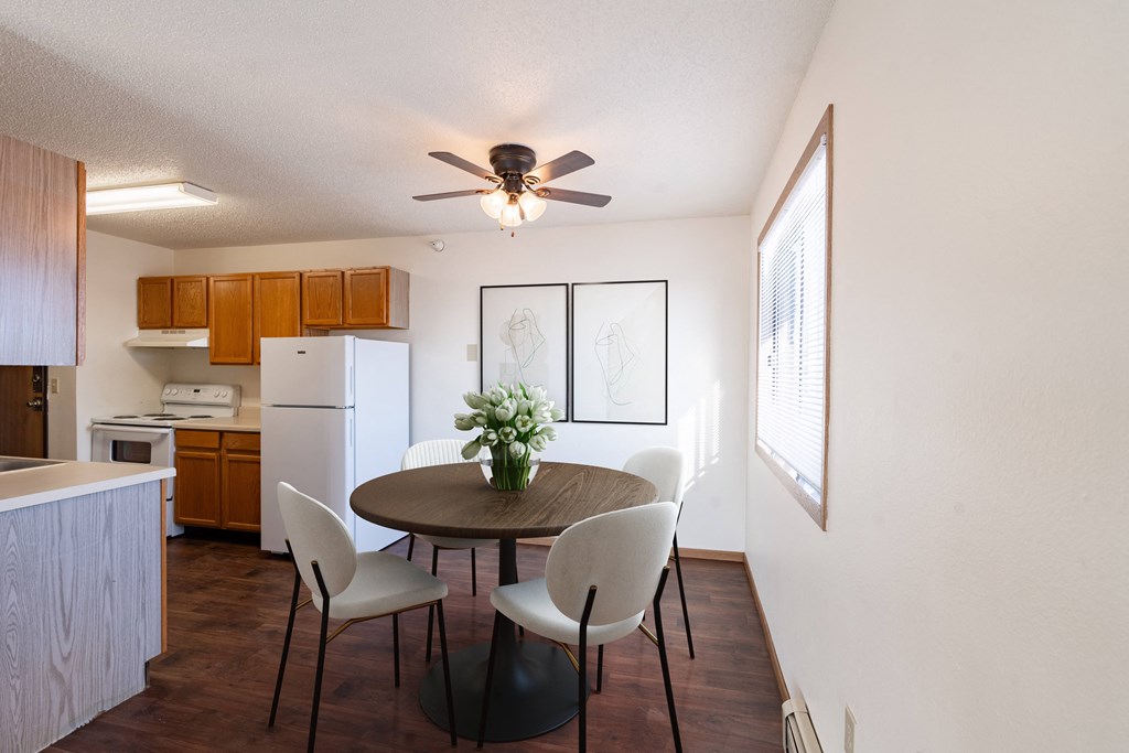 Fargo, ND Fieldstone Apartments | 21A | Dining A dining room with a table and chairs. Fargo, ND Fieldstone Apartments