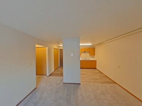 A white door is in the middle of a hallway.