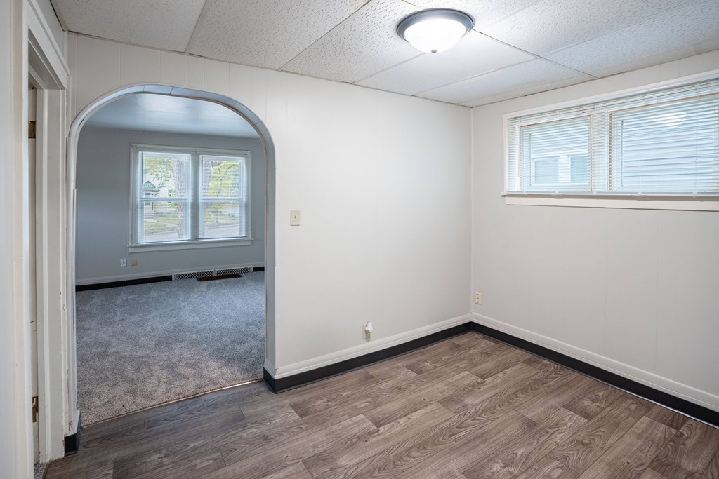 A room with a window and a door. Fargo, ND Marlowe South Apartments