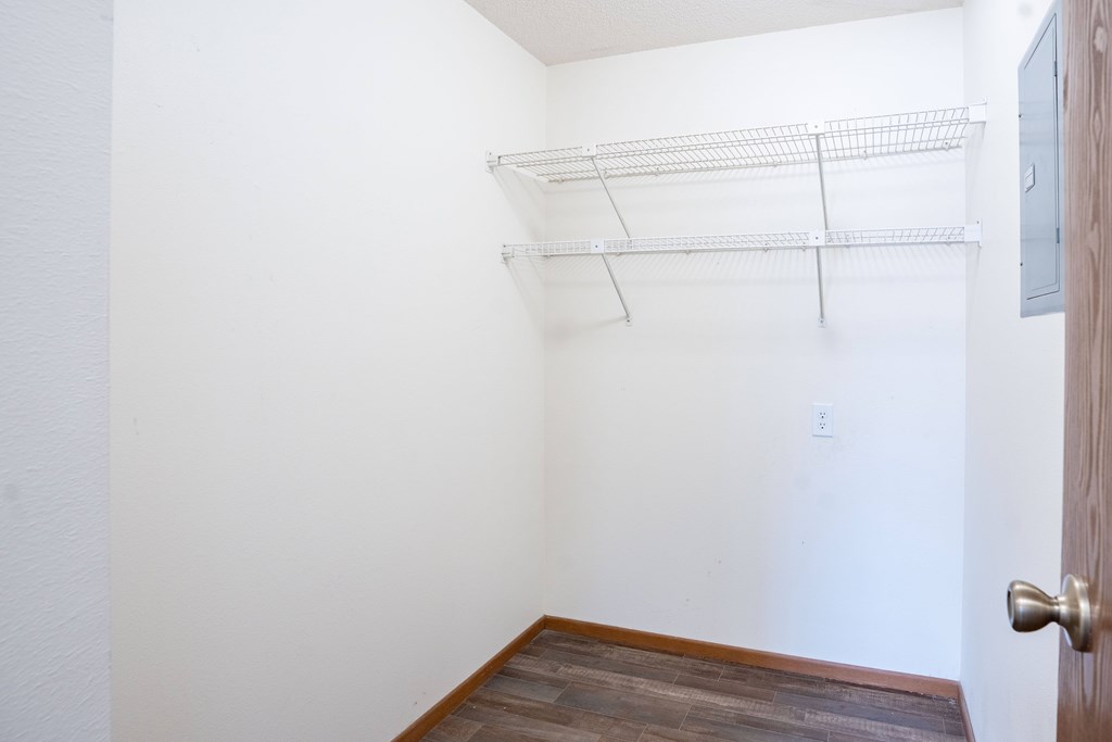 A white wall with a door and a shelf. Fargo, ND Westwood Estates