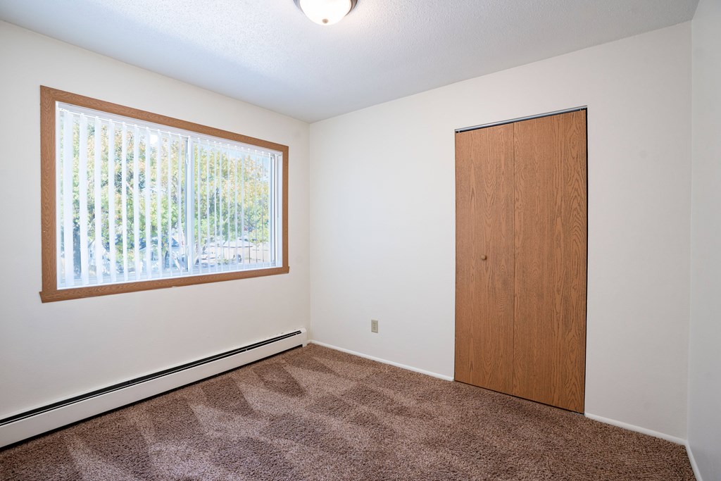 A room with a brown c Fargo, ND Morningside Apartments