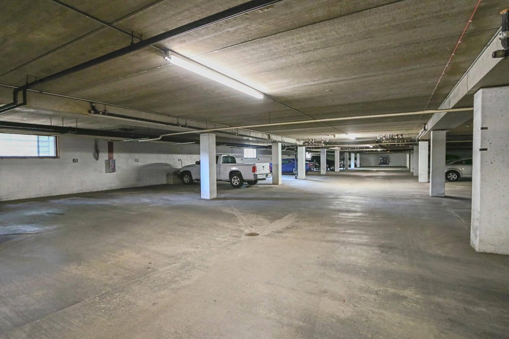 a parking garage with a truck parked in it