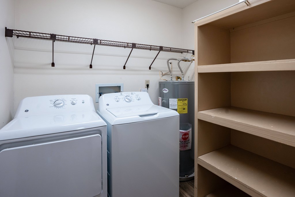 Two front loading washing machines in a laundry room. West Fargo, ND Clearview Apartments