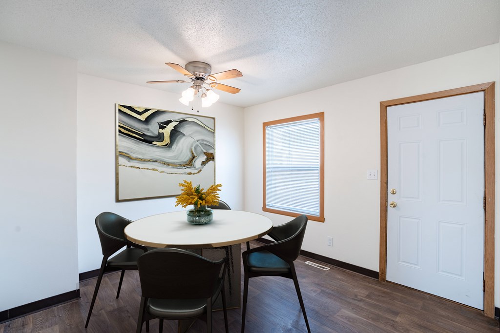 West Fargo, ND Sheyenne Terrace Townhomes | 42C | Dining A dining room with a round table and chairs. West Fargo, ND Sheyenne Terrace Townhomes