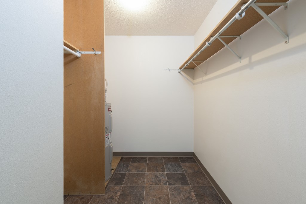 Bismarck, ND Bradbury Apartment. A small laundry room with a washer and dryer