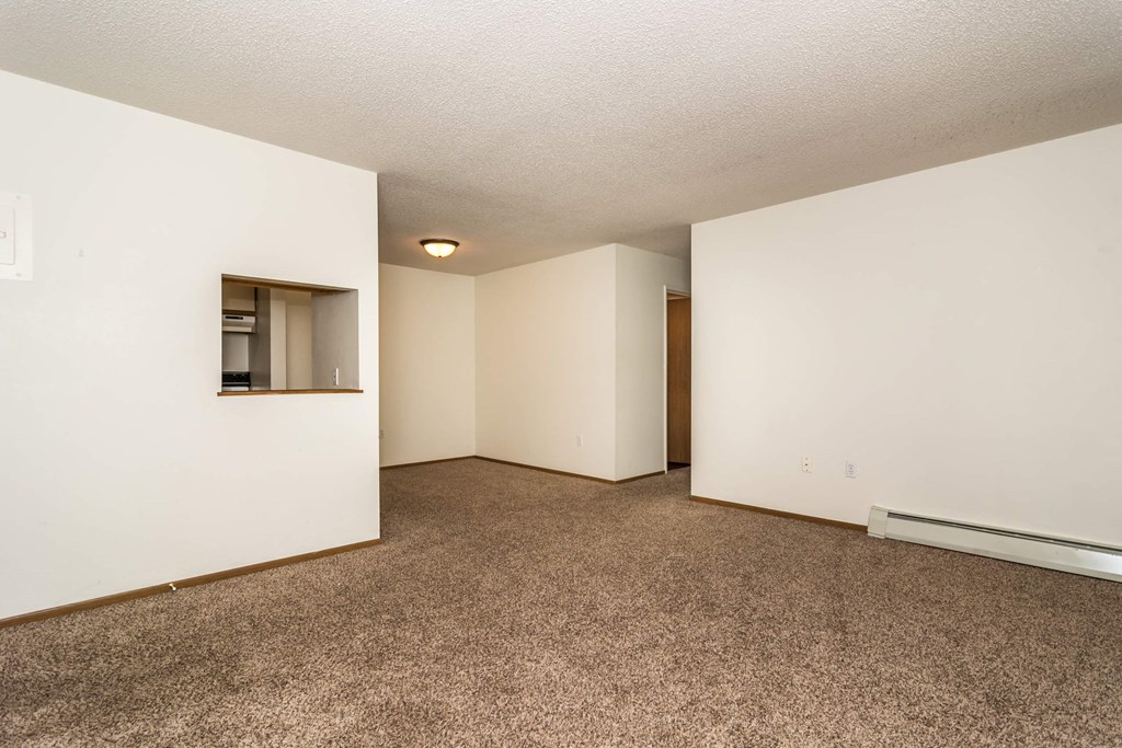 Grand Forks, ND Bristol Park Apartments. a bedroom with white walls and carpet