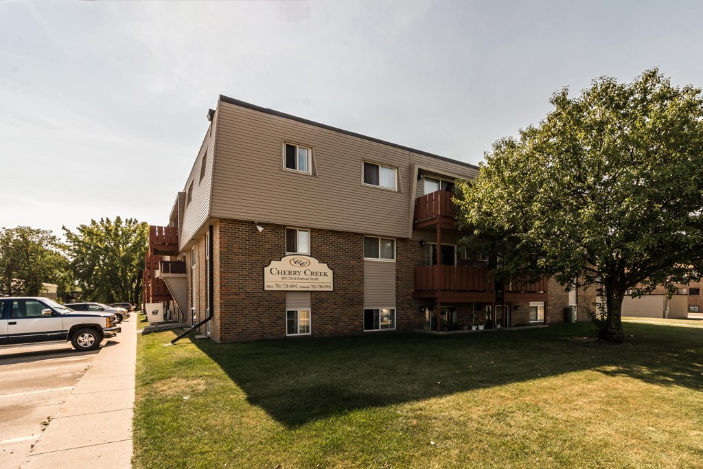 Grand Forks, ND Cherry Creek Apartments | Exterior Grand Forks, ND Cherry Creek Apartments. Exterior with trees