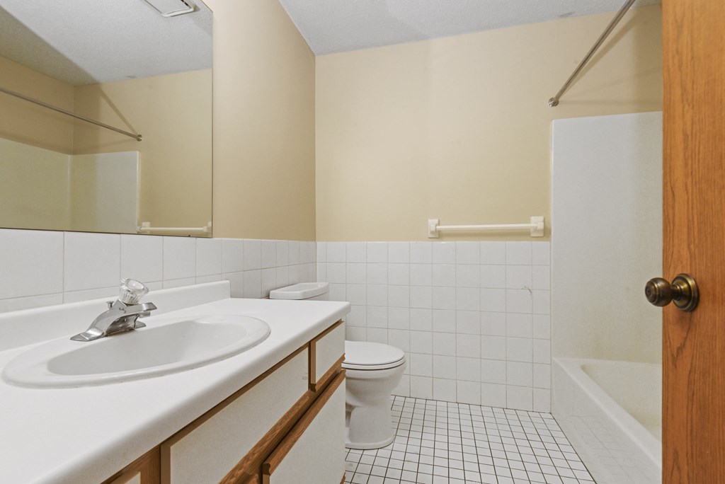 a bathroom with a sink toilet and a bath tub. Anoka, MN Dellwood Estates