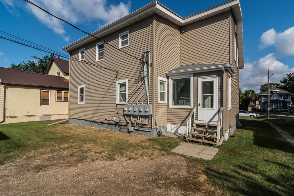 Grand Forks, ND Faul 4 Plex. A view of the back of the house from the driveway