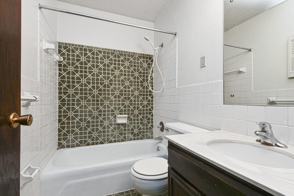 Fridley, MN Georgetown Apartments. A bathroom with a sink toilet and bathtub