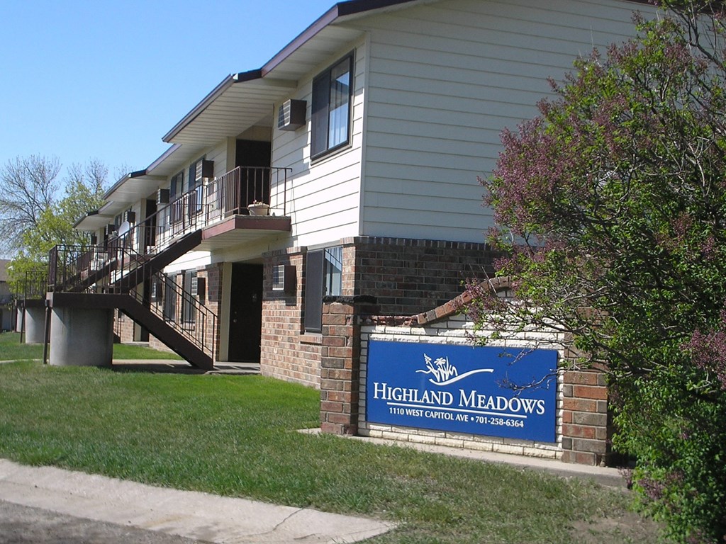The exterior of a two level apartment building The exterior of a two level apartment building at Highland Meadows in Bismarck, ND