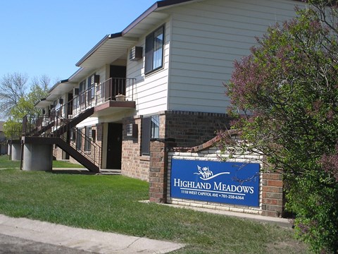 The exterior of a two level apartment building at Highland Meadows in Bismarck, ND