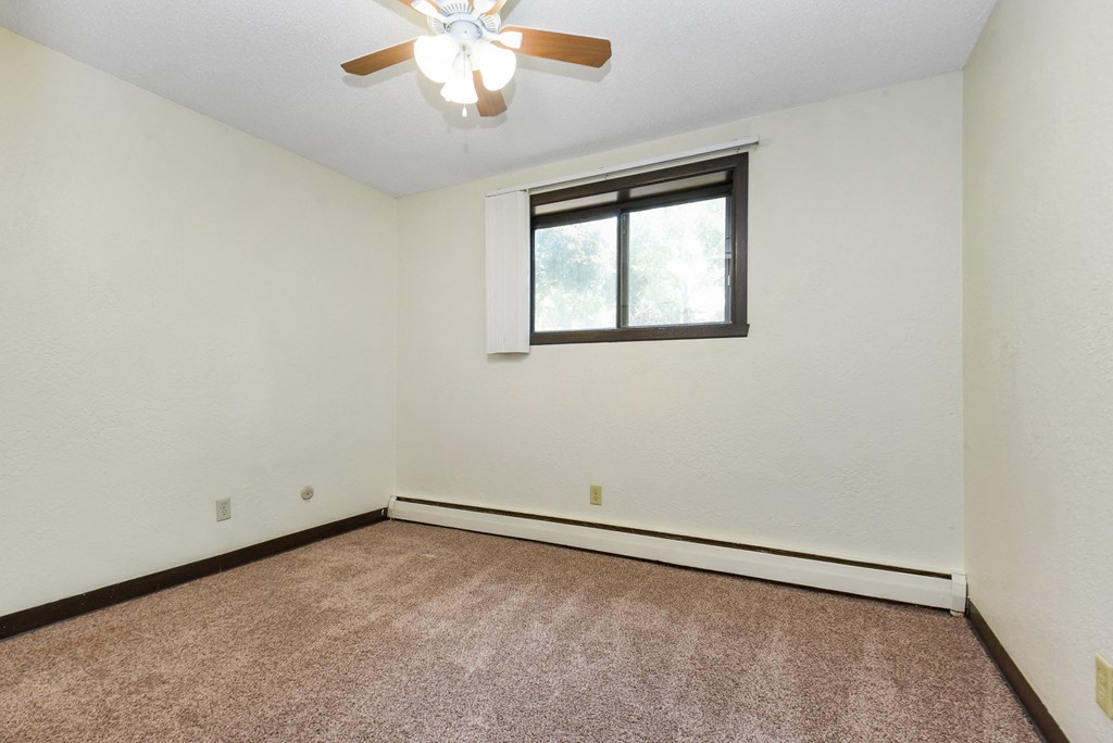 White Bear Lake, MN White Bear Terrace Apartments.  a bedroom with a ceiling fan and a window