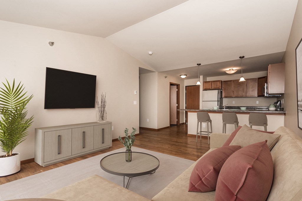 Apartments. a living room with a couch and a table Apartments. a living room with a couch and a table at Sterling Pointe, Grand Forks, 58201
