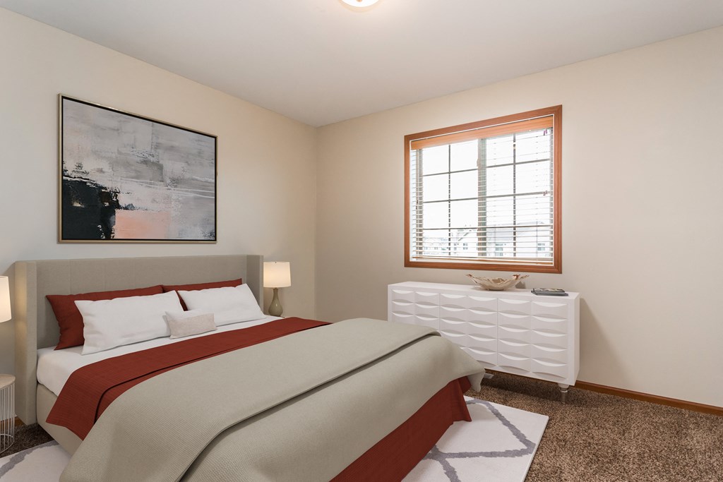 a bedroom with a bed and a window a bedroom with a bed and a window at Sterling Pointe, Grand Forks, 58201