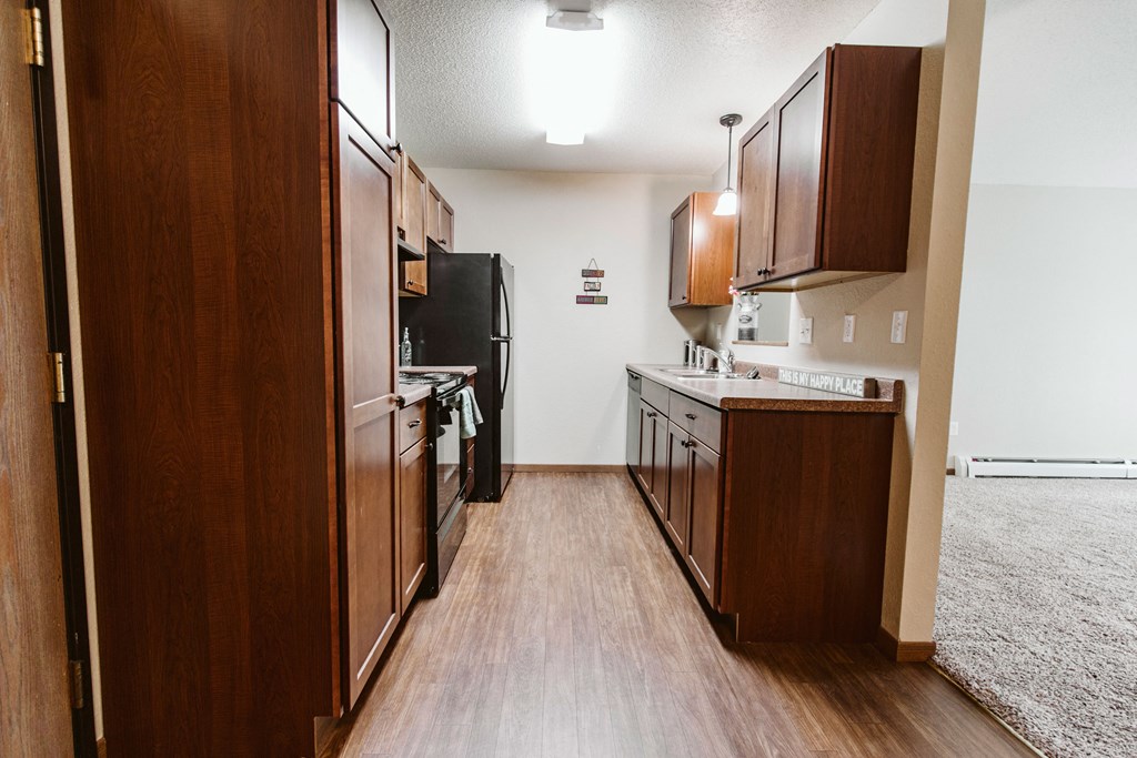 Grand Forks, ND Grandview II Apartments. A kitchen with black appliances.