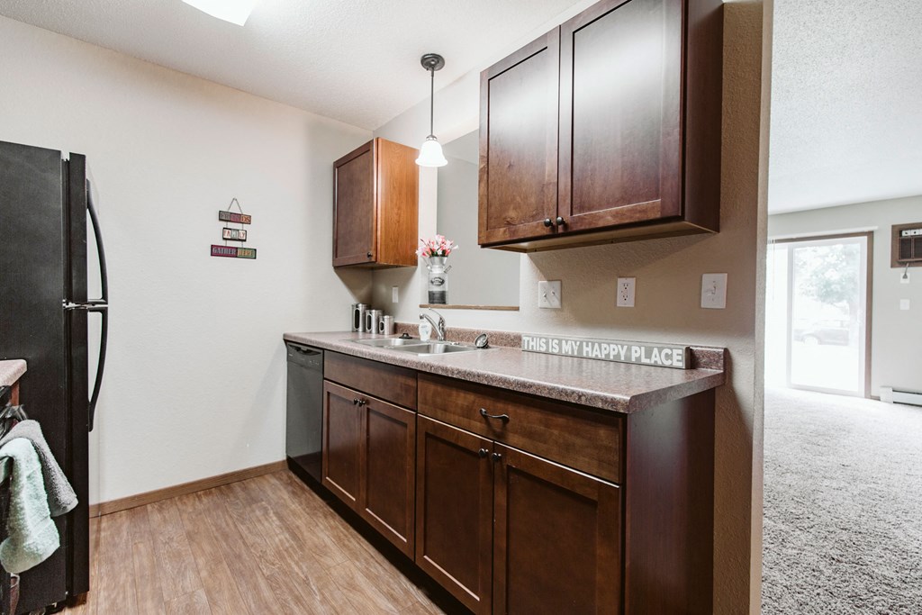 Grand Forks, ND Grandview II Apartments. A kitchen with black appliances.