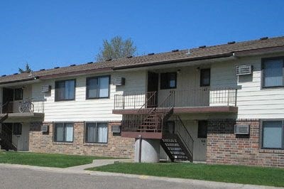 an apartment building with stairs on the side of it. Bismarck, ND Highland Meadows Apartments