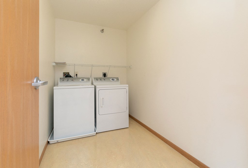 a laundry room with a washer and dryer.Fargo, ND Sunrise North