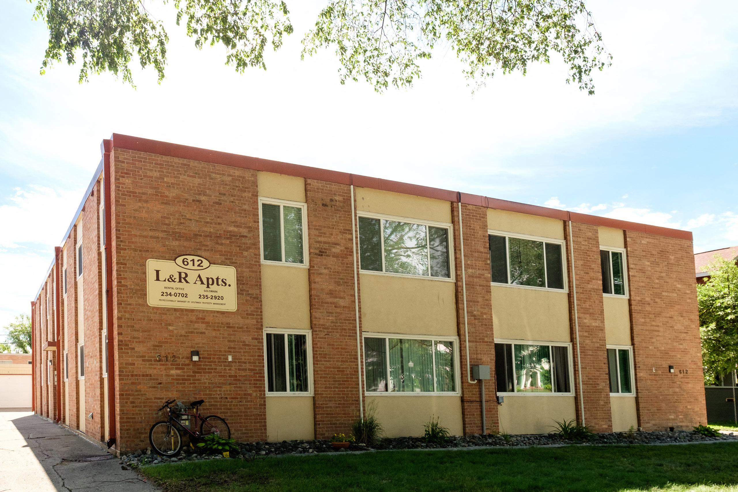 a brick building with a bike parked outside of it