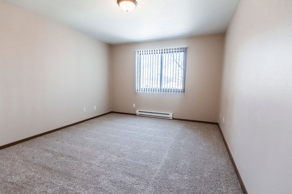Grand Forks, ND Library Lane Apartments a large empty room with a window