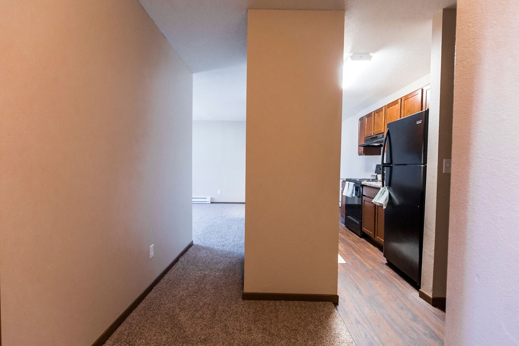 Grand Forks, ND Library Lane Apartments a view of the kitchen and living room from the hallway