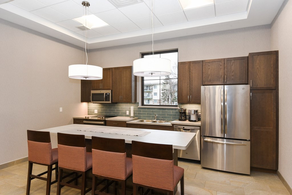 Montreal Courts Apartments in Little Canada, MN | Community Room Kitchen