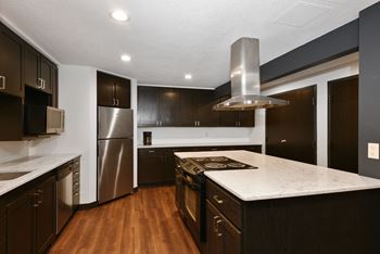 The Edge of Uptown Apartments | Community Room Kitchen With Large Countertops