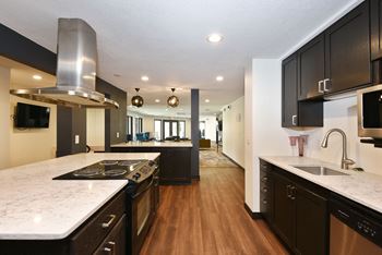 The Edge of Uptown Apartments | Community Room Kitchen with sink and stove