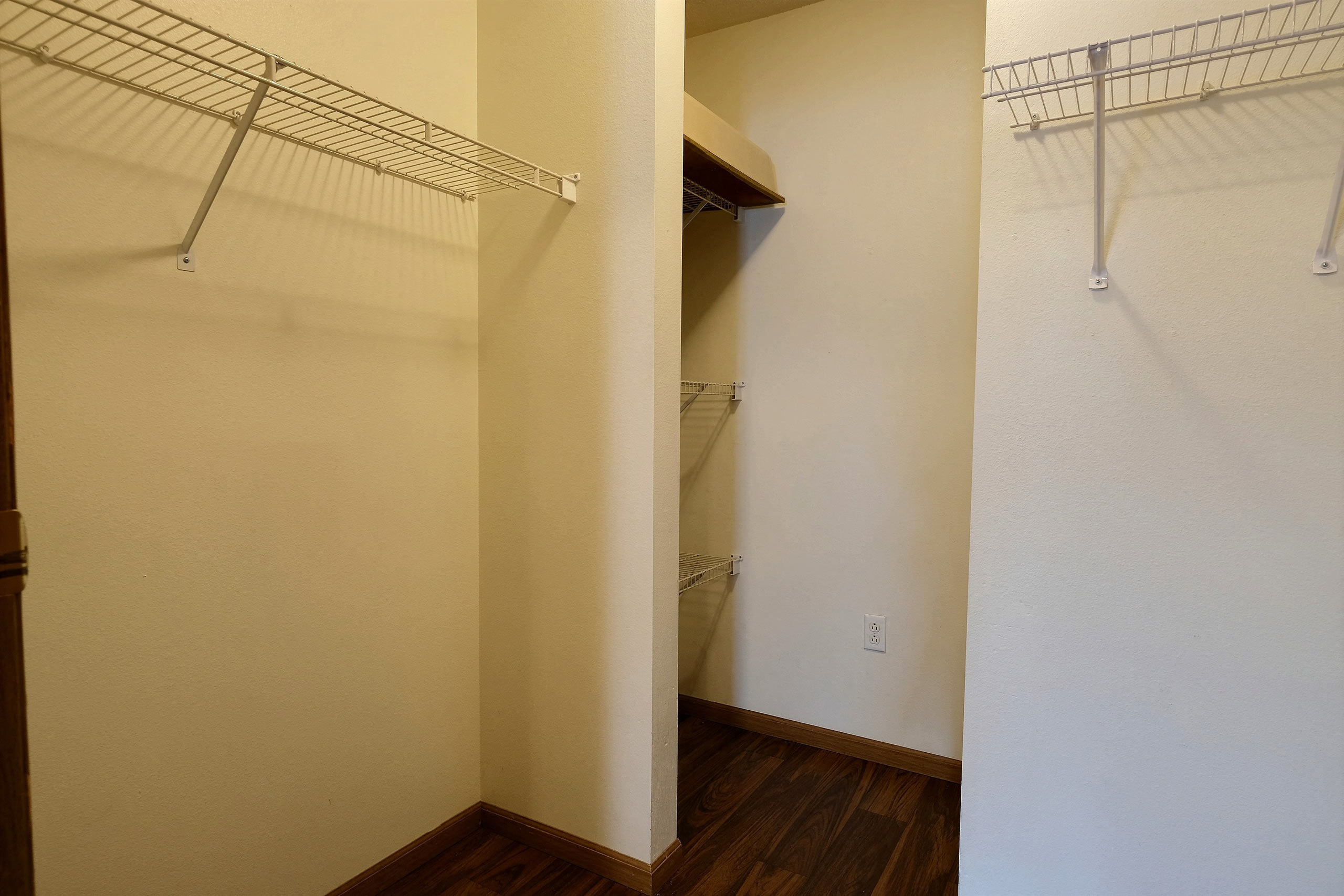 A closet with shelves. Fargo, ND Oxford Apartments.
