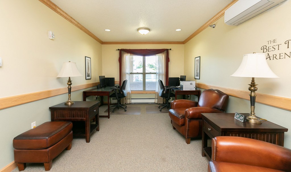 a library with chairs and a large window. Fargo, ND Sunrise North