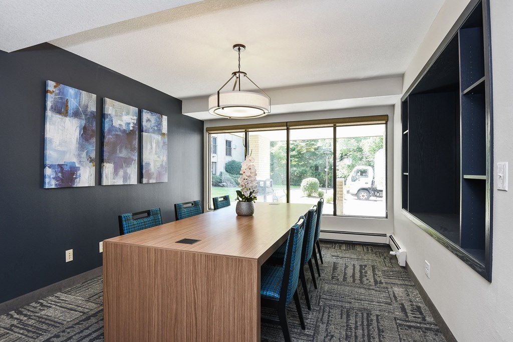 The Edge of Uptown Apartments | Conference Room with Large Table and 6 Chairs