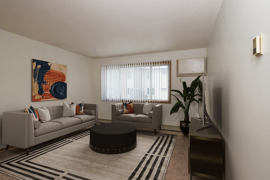 Fargo, ND Park Circle Apartments. a living room with two couches and a coffee table