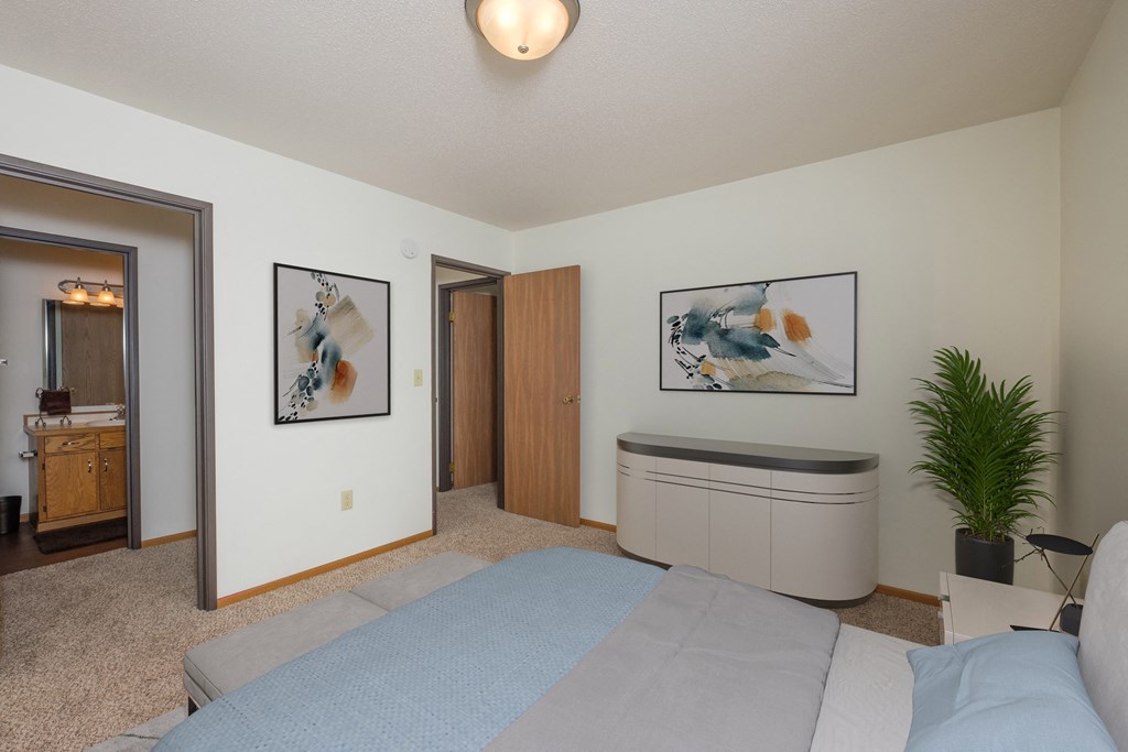Fargo, ND Park Circle Apartments.  a bedroom with a bed and a bathtub