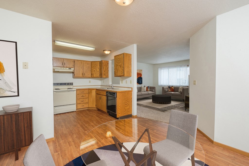 Fargo, ND Park Circle Apartments. a kitchen and living room in a 555 waverly unit