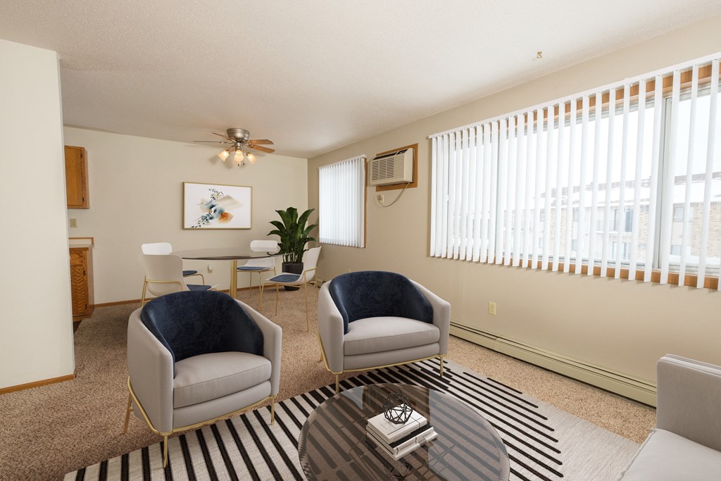 Fargo, ND Park Circle Apartments. a living room with two chairs and a coffee table