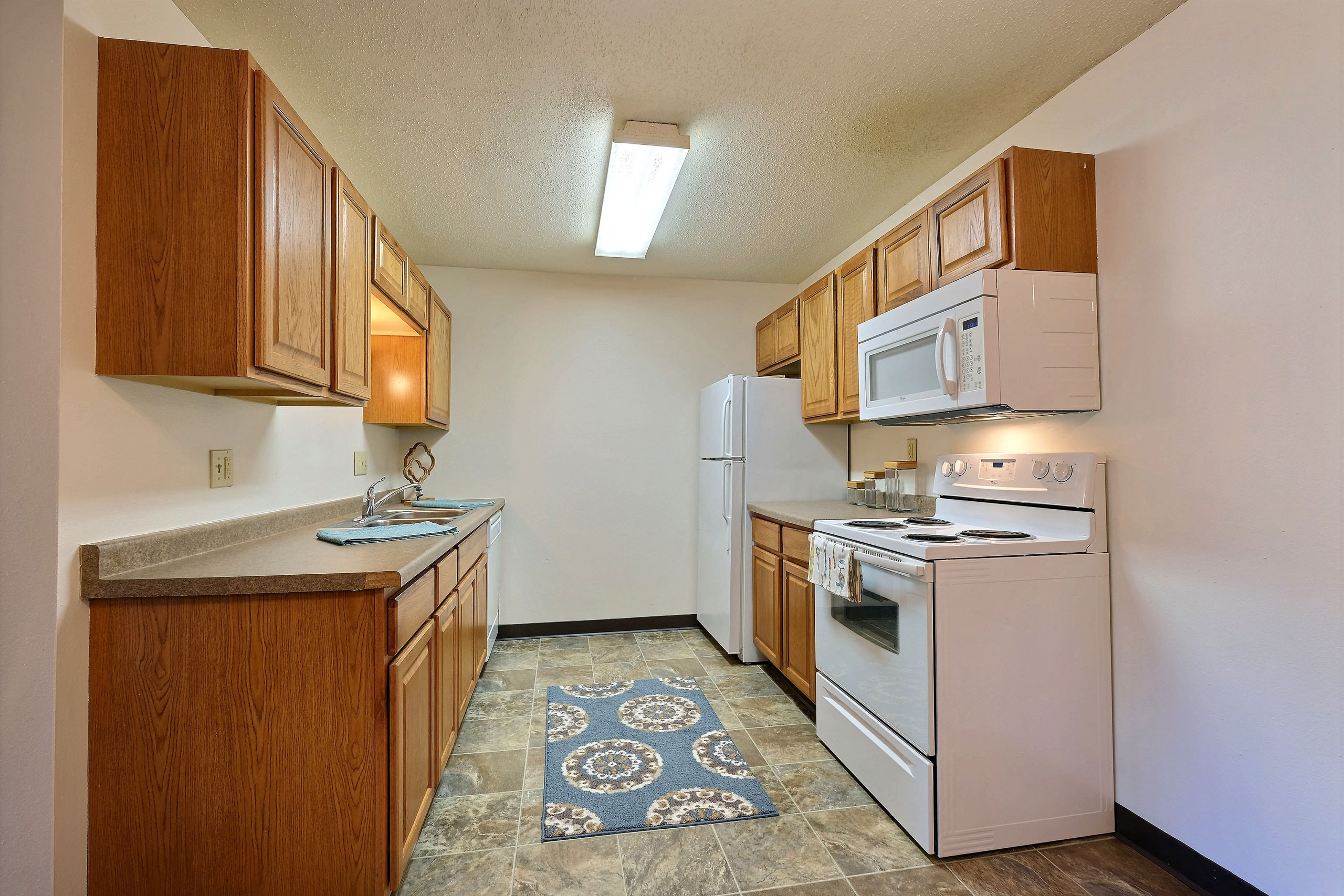 Prairiewood Courts Apartments | 2 Bdrm - Kitchen