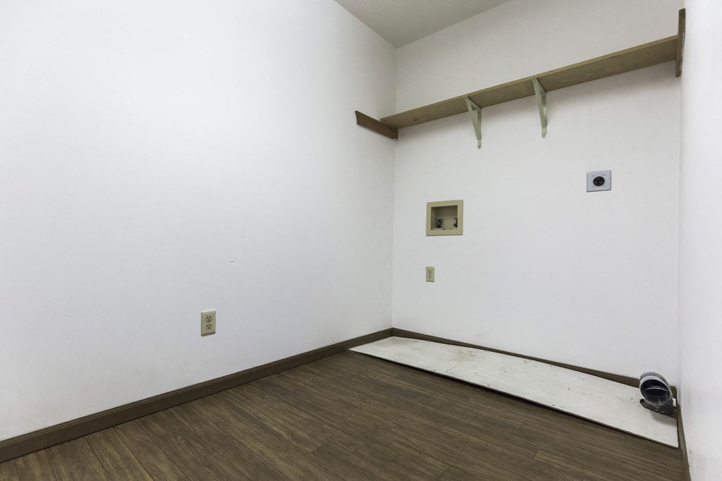 Grand Forks Primrose Apartments. an empty closet with washer and dryer hookups