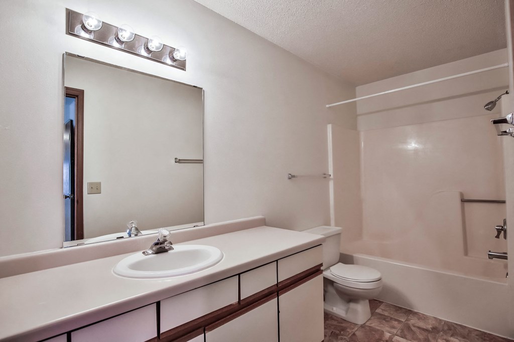 Grand Forks Primrose Apartments. A bathroom with a sink and a toilet