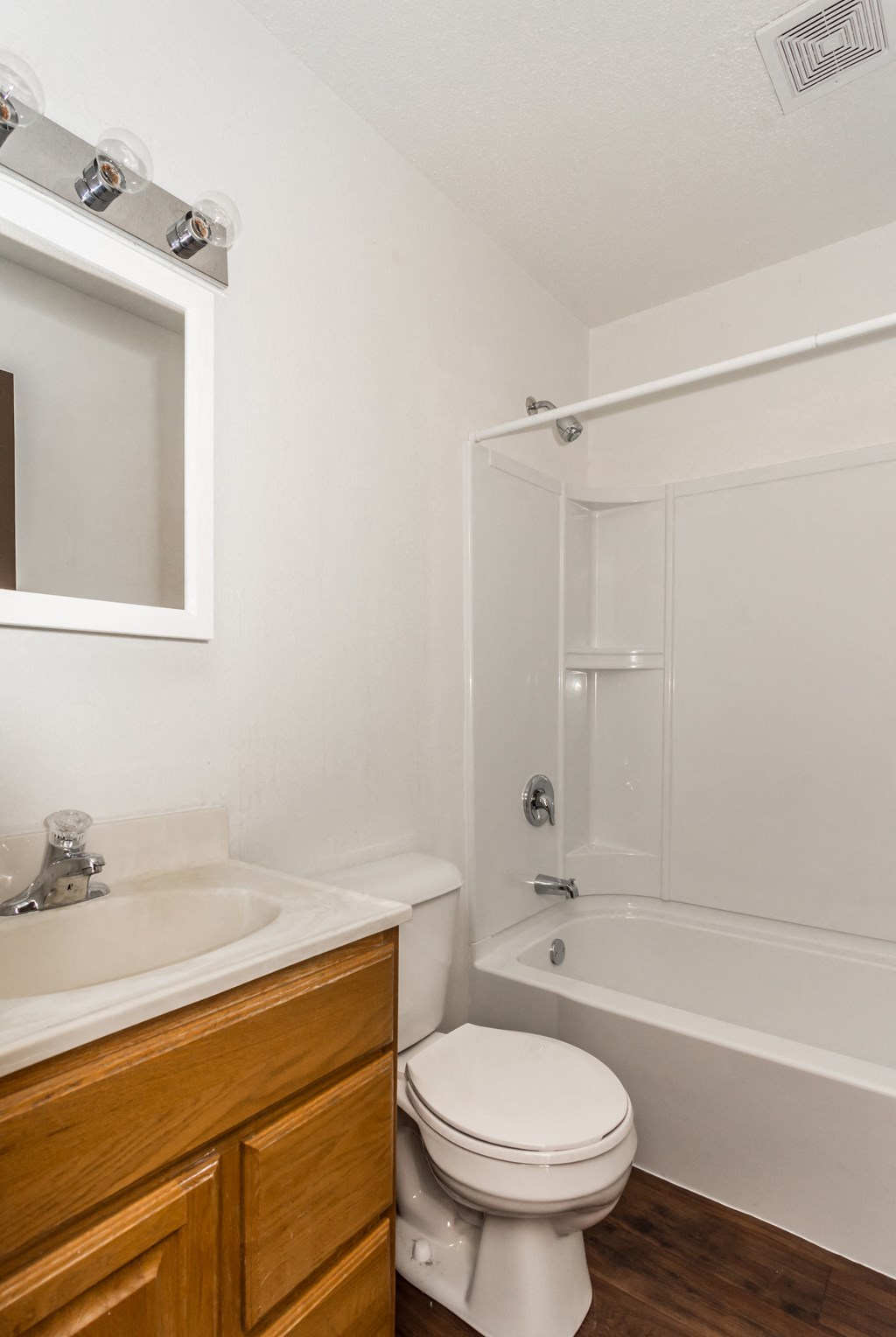 Grand Forks, ND Riverwood Apartments. A bathroom with a sink toilet and a shower